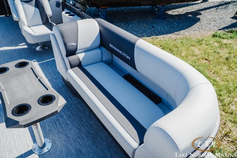 Slide: The Image of 2026 Bennington 22SSR boat interior with plush seating and cup holders. - 16
