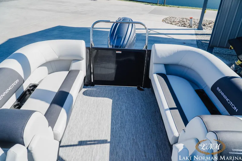 Slide: The Image of 2026 Bennington 22SSR pontoon boat interior with plush seating at Lake Norman Marina. - 18