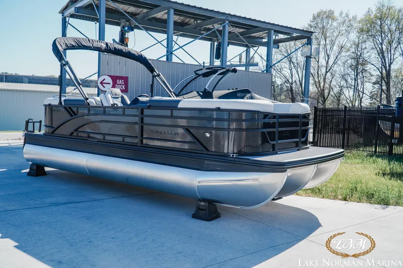 Slide: The Image of 2026 Bennington 22SSR pontoon boat at Lake Norman Marina, parked near gas dock. - 3