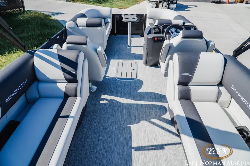 Slide: The Image of 2026 Bennington 22SSR pontoon boat interior with plush seating and modern helm. - 4