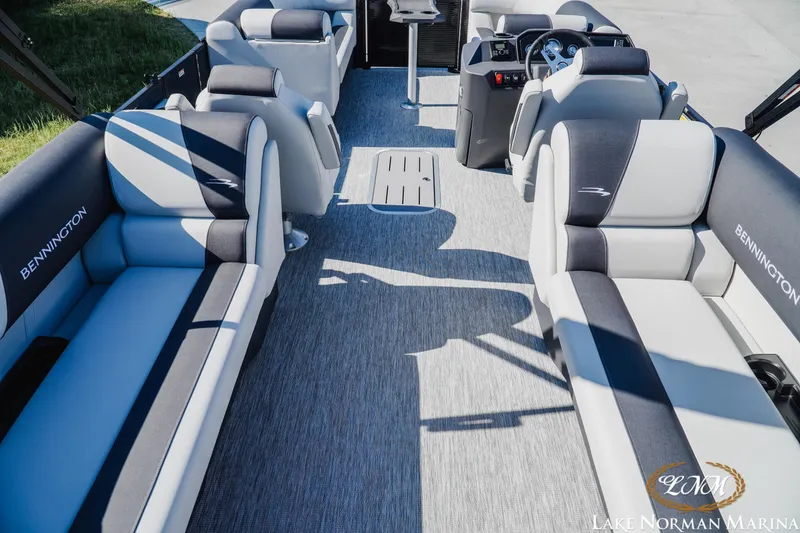 Slide: The Image of 2026 Bennington 22SSR pontoon boat interior with plush seating and modern design. - 5