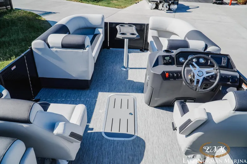 Slide: The Image of 2026 Bennington 22SSR pontoon boat interior with modern seating and steering console. - 8