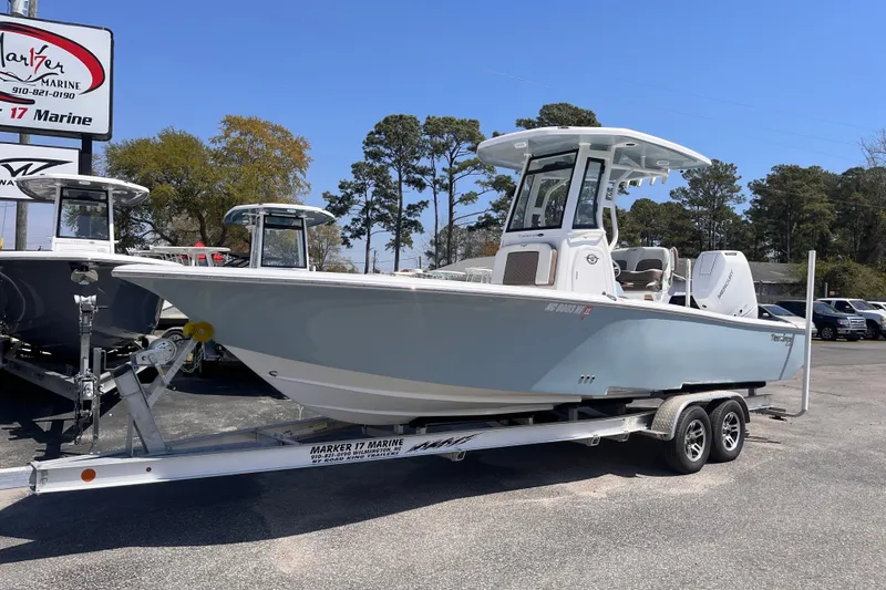 Slide: The Image of 2025 Tidewater 2500 Carolina Bay boat on trailer at dealership. - 1