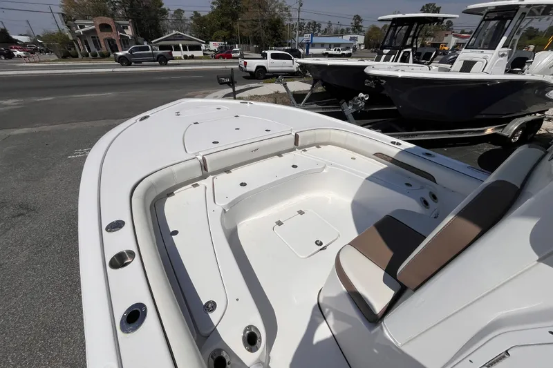 Slide: The Image of 2025 Tidewater 2500 Carolina Bay boat interior with seating and storage compartments. - 11