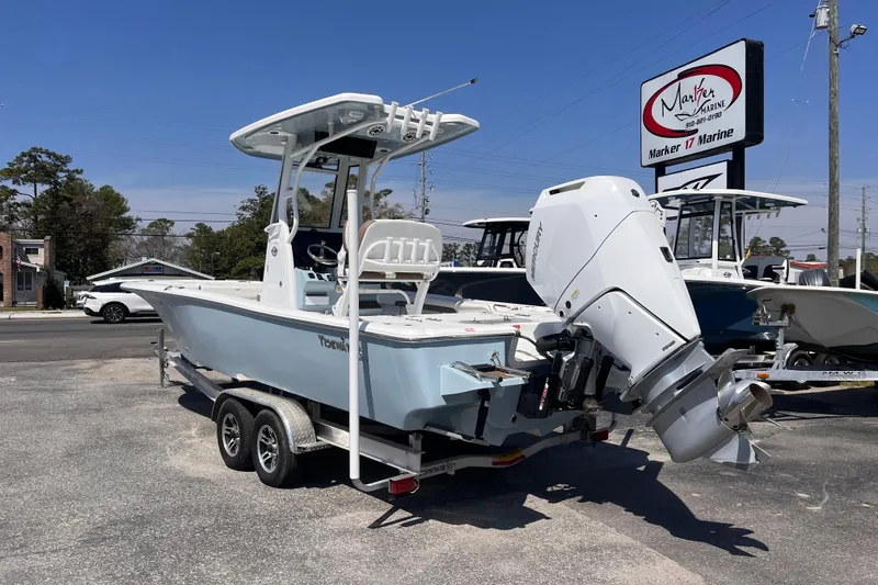 Slide: The Image of 2025 Tidewater 2500 Carolina Bay boat on trailer at Marker 17 Marine dealership. - 2