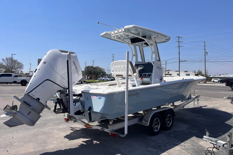Slide: The Image of 2025 Tidewater 2500 Carolina Bay boat on trailer, featuring a powerful Mercury outboard motor. - 4