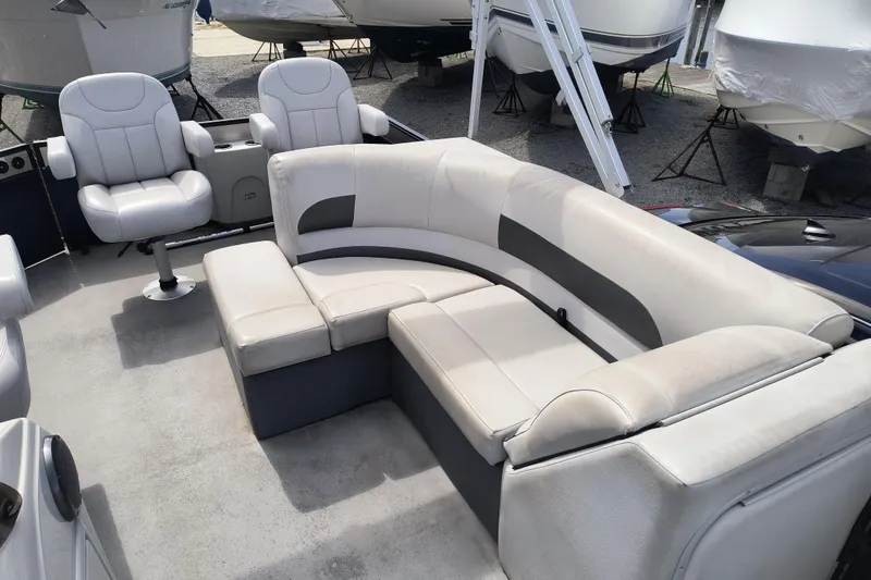 Slide: The Image of 2018 Crest I Fish 220 C4 boat interior with plush seating and modern design. - 7