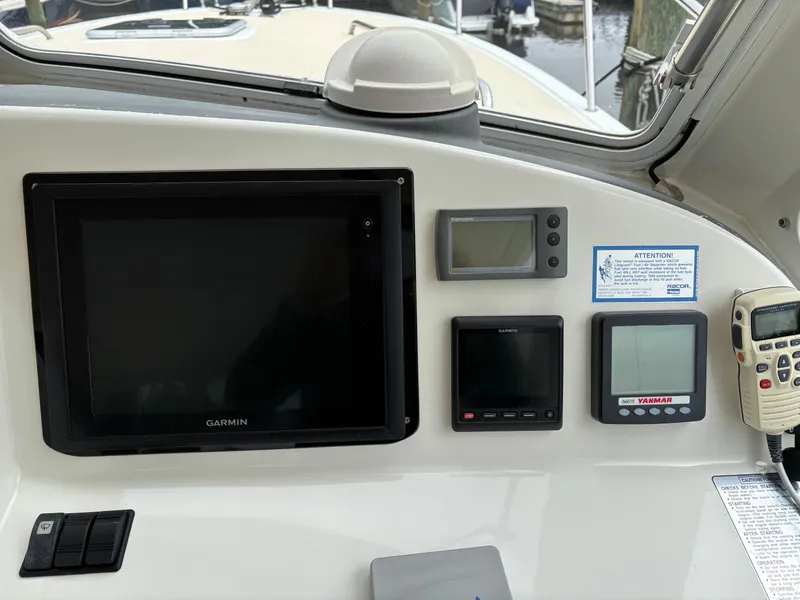 Slide: The Image of Control panel of 2006 MJM 34z Express HT with Garmin navigation system. - 23