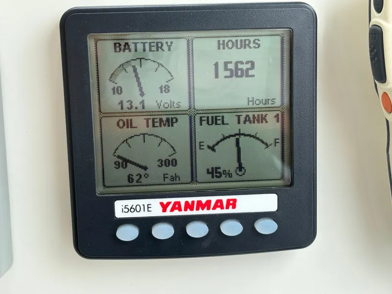Slide: The Image of Yanmar engine display showing battery voltage, engine hours, oil temperature, and fuel level on MJM 34z Express HT. - 27