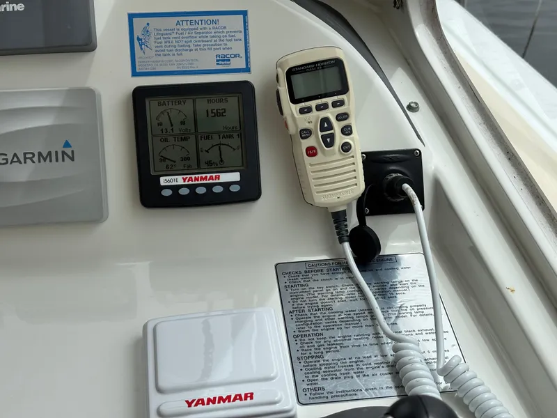 Slide: The Image of Control panel of a 2006 MJM 34z Express HT with Yanmar and Garmin equipment. - 40