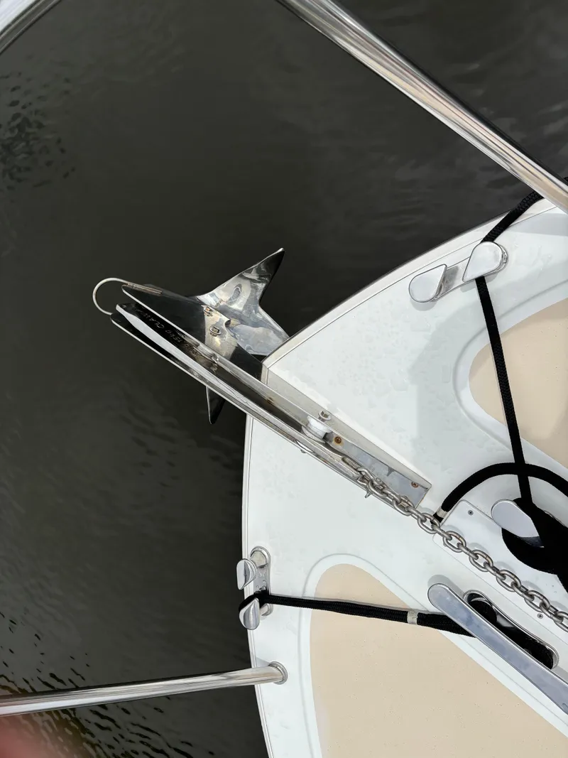 Slide: The Image of Anchor and bow of 2006 MJM 34z Express HT boat on water. - 42