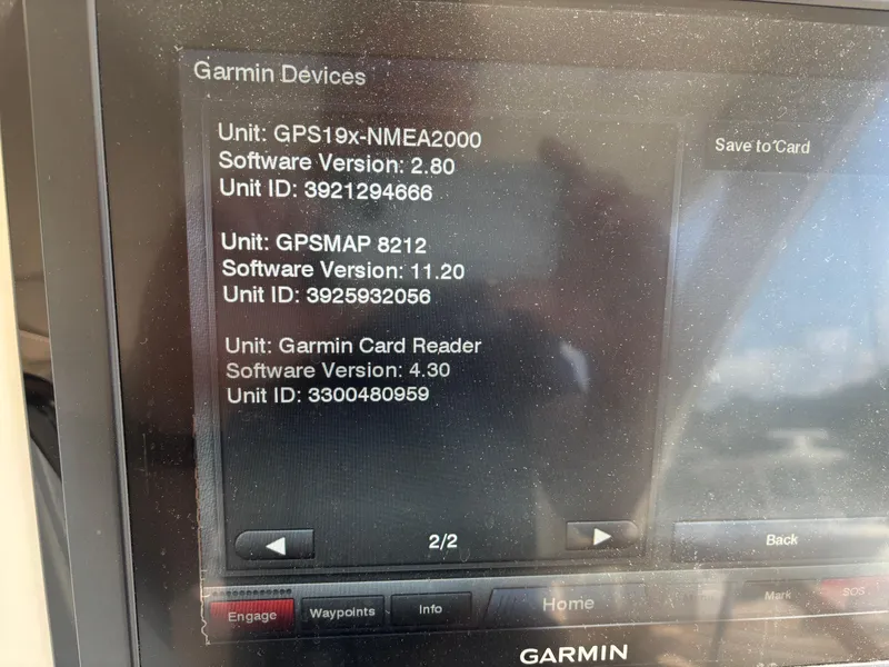 Slide: The Image of Garmin device screen displaying software versions and unit IDs for GPS and card reader. - 47