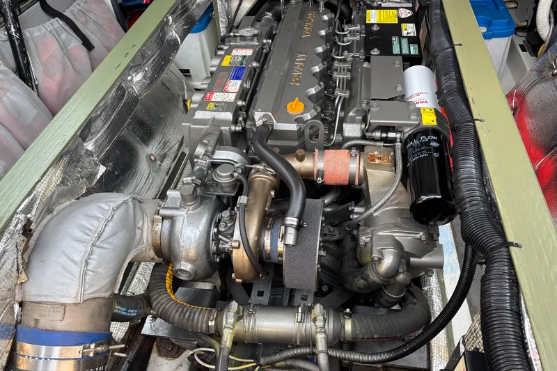 Slide: The Image of Engine compartment of a 2006 MJM 34z Express HT, showcasing detailed mechanical components. - 49
