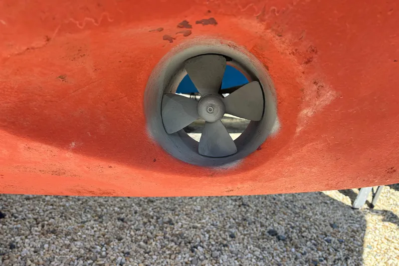 Slide: The Image of Bow thruster on a 2006 MJM 34z Express HT boat, displayed on gravel. - 56