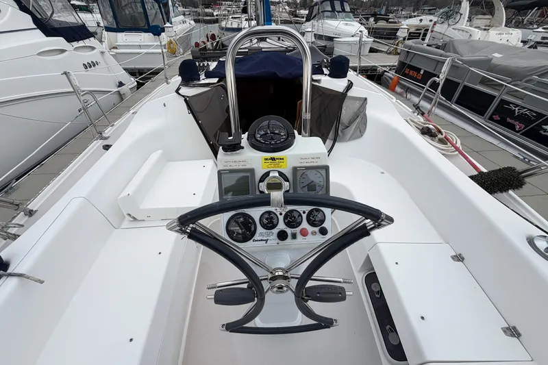 Slide: The Image of Cockpit view of a 2007 Catalina 309 sailboat, showcasing steering wheel and navigation instruments. - 18