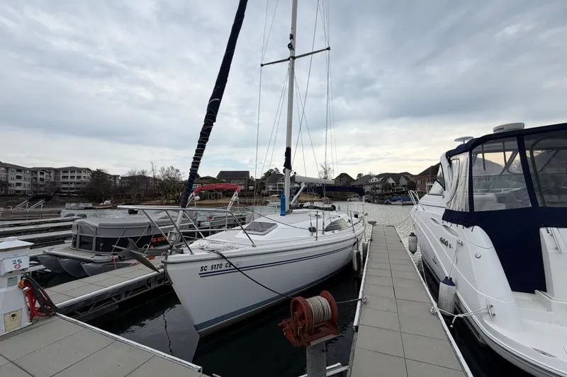 Slide: The Image of Catalina 309 sailboat docked at marina, overcast sky, 2007 model. - 23