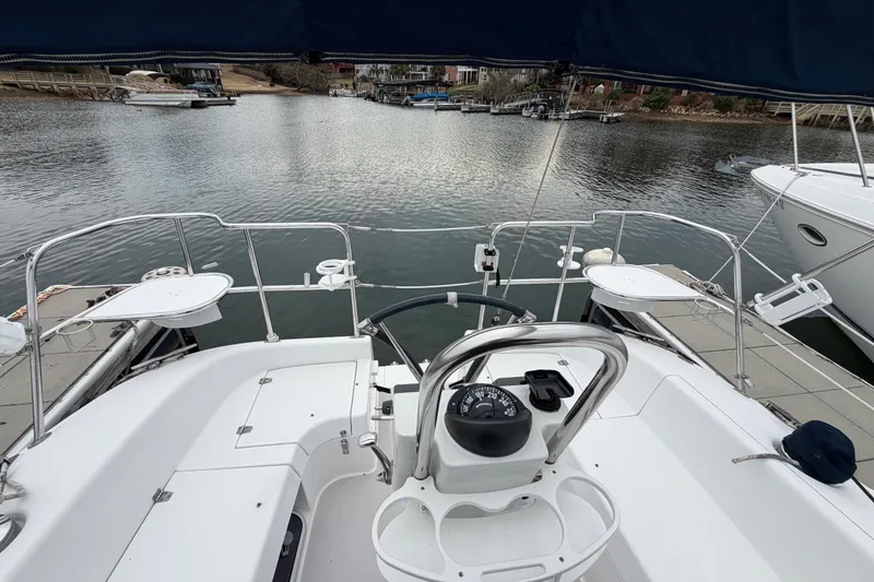 Slide: The Image of Cockpit view of a 2007 Catalina 309 sailboat docked at a marina. - 7