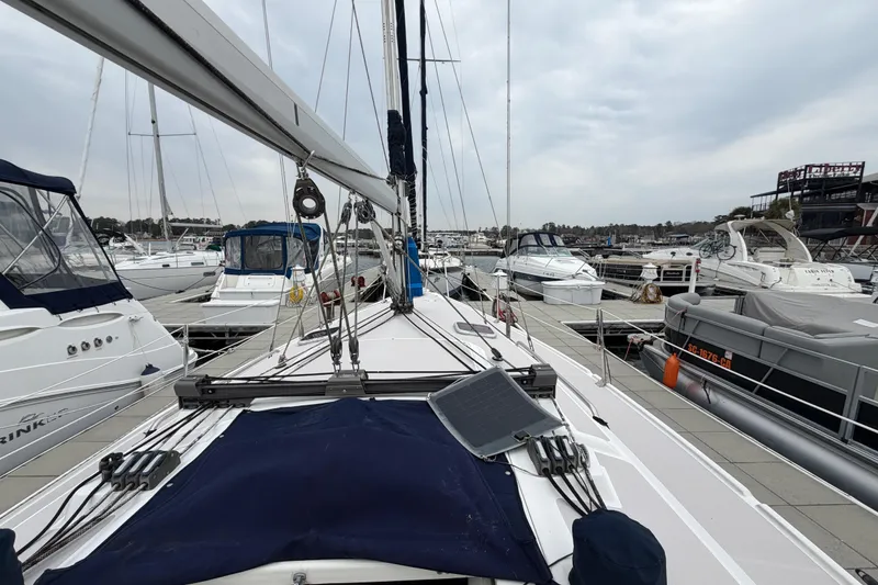 Slide: The Image of Sailboat Catalina 309, 2007 model, docked at marina with other boats. - 9