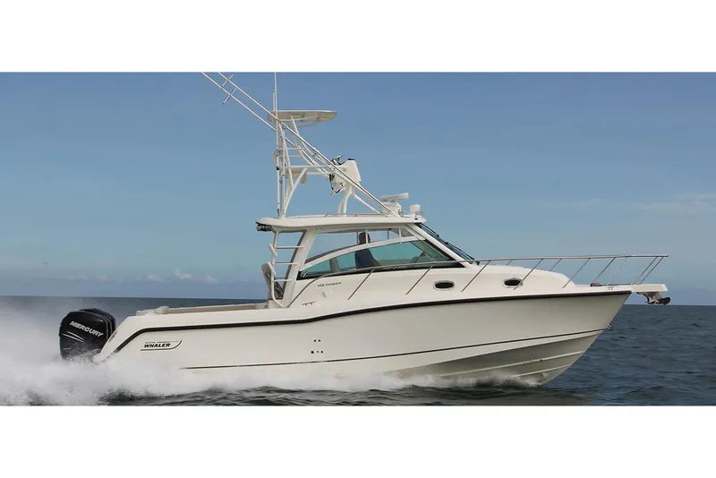 Slide: The Image of Manufacturer Provided Image: 2020 Boston Whaler 345 Conquest cruising on open water at sunset. - 2