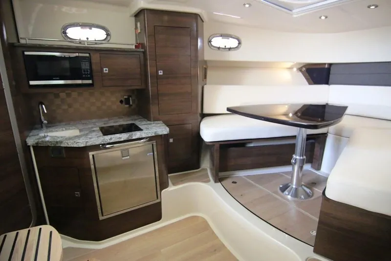 Slide: The Image of Manufacturer Provided Image: 2020 Boston Whaler 345 Conquest interior with helm station and seating area. - 8