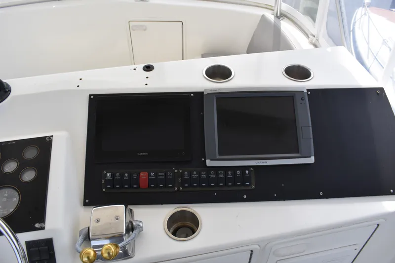 Slide: The Image of Control panel of a 1998 Ocean Yachts 40 Super Sport with Garmin displays. - 15