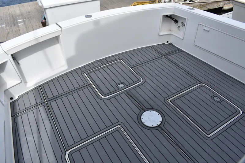 Slide: The Image of 1998 Ocean Yachts 40 Super Sport boat deck with sleek, modern design and storage compartments. - 19