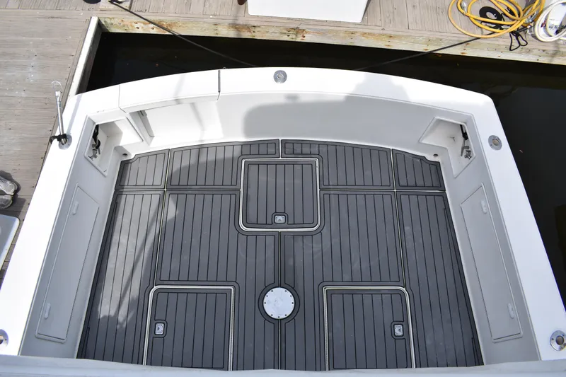 Slide: The Image of 1998 Ocean Yachts 40 Super Sport boat deck with sleek, modern design and storage compartments. - 20