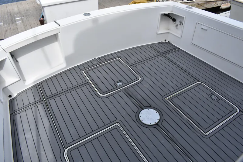 Slide: The Image of 1998 Ocean Yachts 40 Super Sport boat deck with gray non-slip flooring. - 22