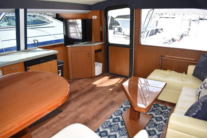 Slide: The Image of Interior of 1998 Ocean Yachts 40 Super Sport with modern furnishings and large windows. - 26