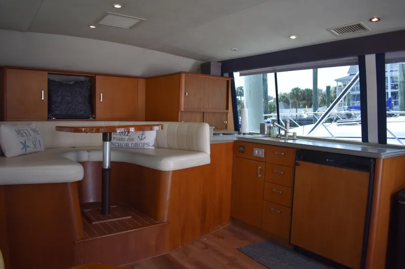 Slide: The Image of Interior of 1998 Ocean Yachts 40 Super Sport with cozy seating and kitchenette. - 28