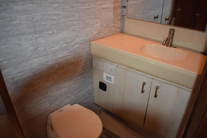 Slide: The Image of Bathroom interior of 1998 Ocean Yachts 40 Super Sport with sink and toilet. - 37
