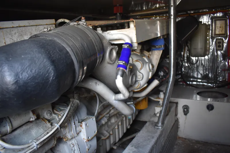 Slide: The Image of Engine room of a 1998 Ocean Yachts 40 Super Sport, showcasing mechanical components. - 39