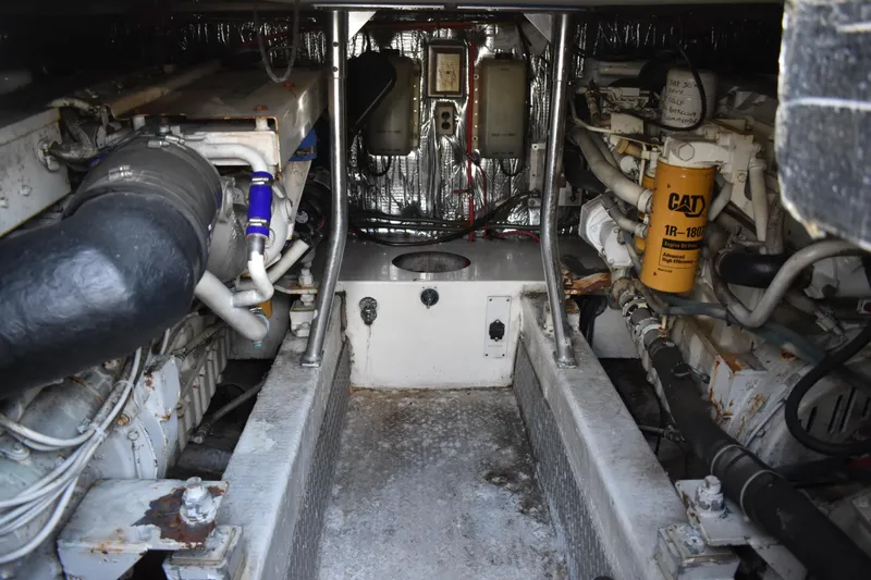 Slide: The Image of Engine room of a 1998 Ocean Yachts 40 Super Sport, featuring CAT machinery and components. - 40