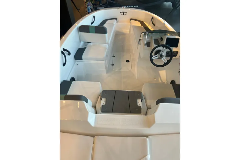 Slide: The Image of 2026 Tahoe T16 boat interior with seating and steering wheel, showcasing modern design. - 5
