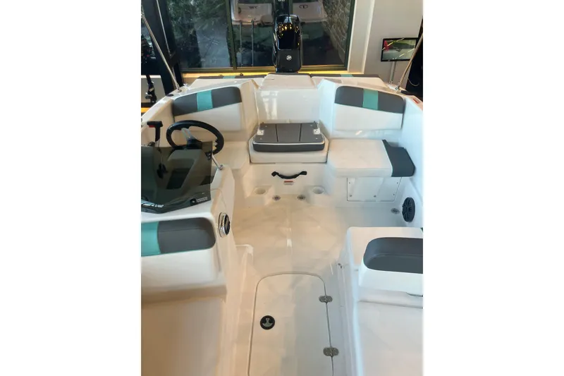 Slide: The Image of 2026 Tahoe T16 boat interior with modern seating and steering console. - 6