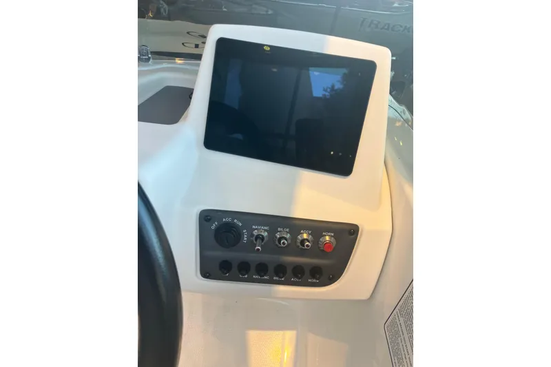 Slide: The Image of 2026 Tahoe T16 boat dashboard with touchscreen and control panel. - 9
