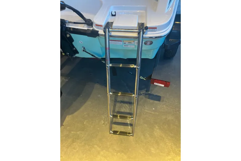 Slide: The Image of 2026 Tahoe T16 boat with a metal boarding ladder extended. - 3