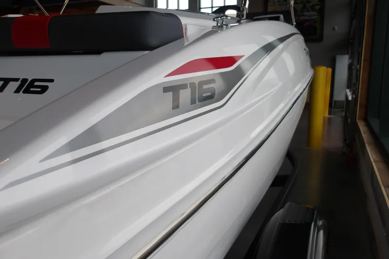Slide: The Image of 2026 Tahoe T16 boat, sleek white design with red and gray accents. - 12