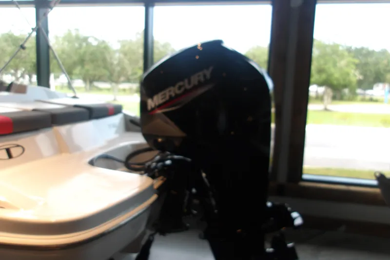 Slide: The Image of 2026 Tahoe T16 boat with Mercury outboard motor in showroom. - 3