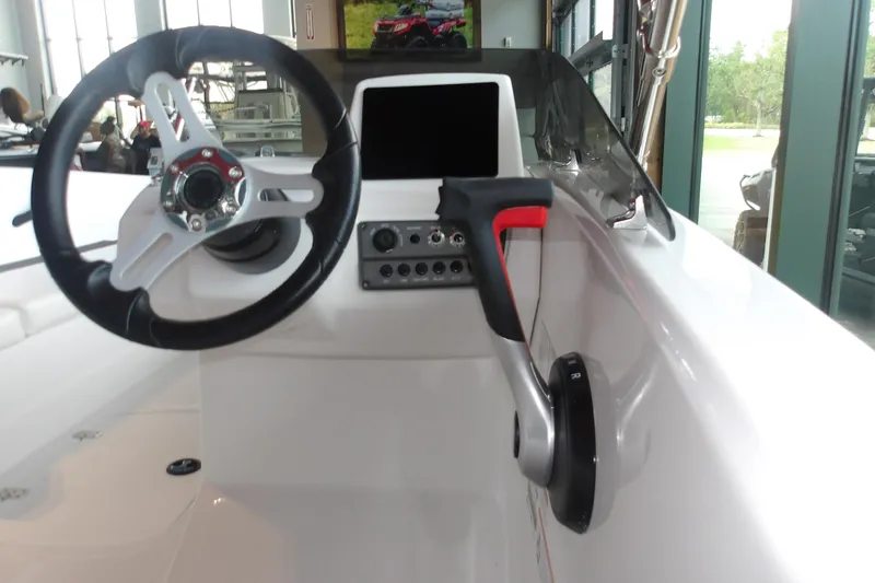 Slide: The Image of Steering console of 2026 Tahoe T16 boat with modern controls and sleek design. - 7