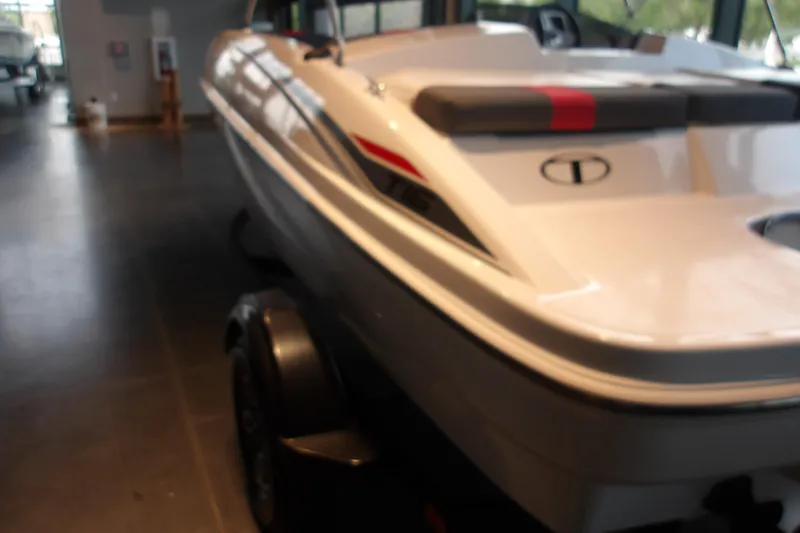 The Image of 2026 Tahoe T16 boat displayed indoors on a trailer. - 1