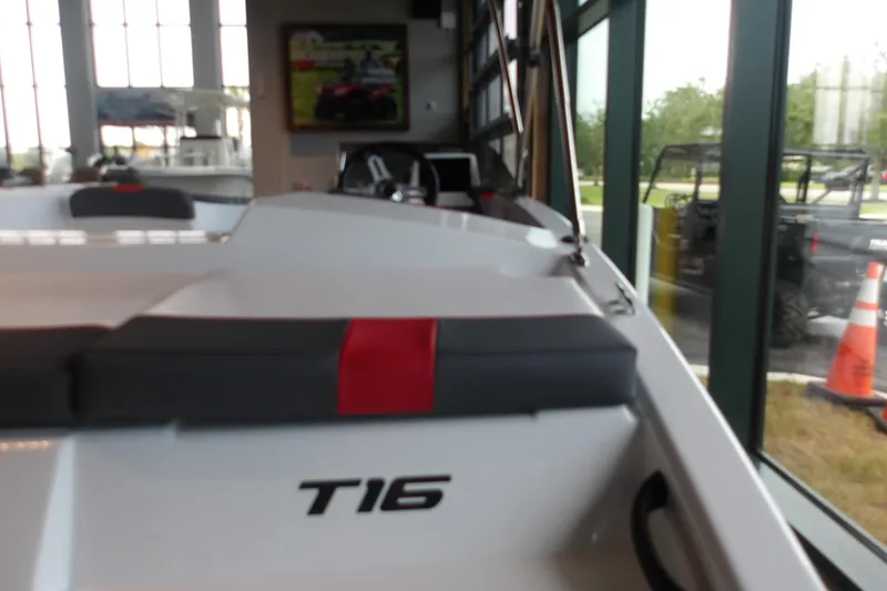 Slide: The Image of 2026 Tahoe T16 boat interior with modern design and red accents. - 5