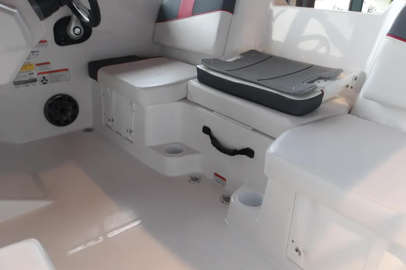Slide: The Image of Interior of 2026 Tahoe T16 boat with white seating and storage compartments. - 8