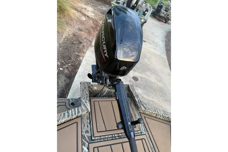 Slide: The Image of 2026 Tracker Grizzly 1650 T Prairie Wings Edition with Mercury outboard motor, camo design. - 9