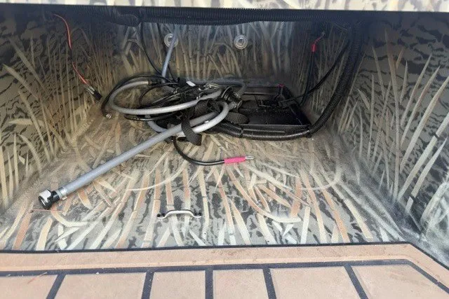 Slide: The Image of Interior view of 2026 Tracker Grizzly 1650 T Prairie Wings Edition, showcasing wiring and camouflage design. - 13