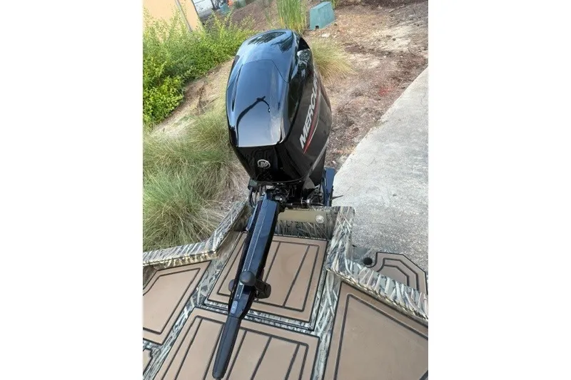 Slide: The Image of 2026 Tracker Grizzly 1650 T Prairie Wings Edition with Mercury outboard motor, camo deck. - 8