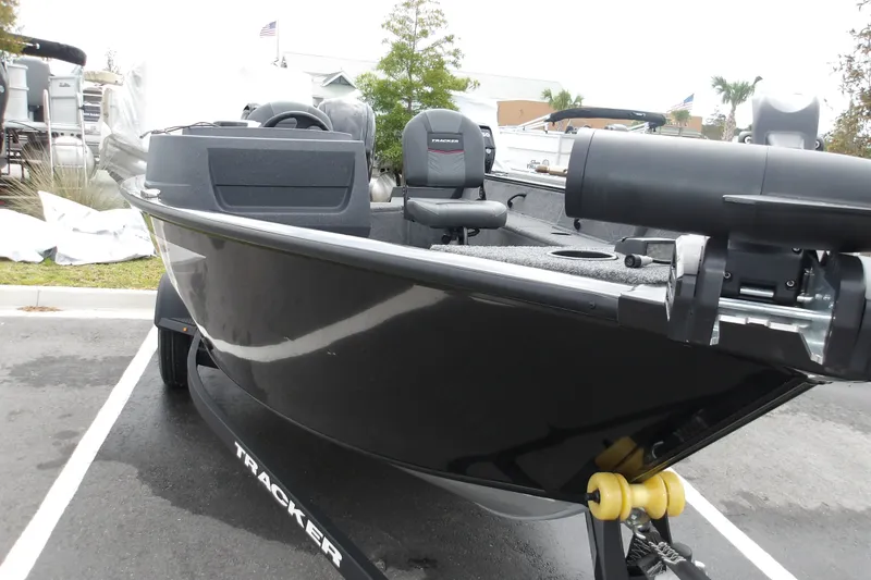 Slide: The Image of 2026 Tracker Pro Guide V-16 SC boat on trailer, parked outdoors. - 17