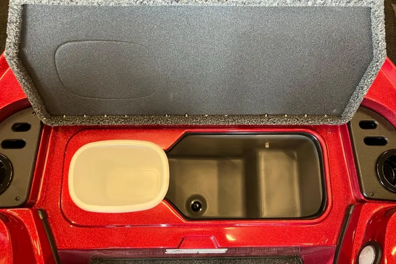 Slide: The Image of Open storage compartment in a 2026 Nitro Z18 boat, featuring a red and black interior. - 7