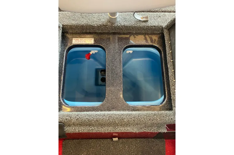 Slide: The Image of Livewell compartments in a 2026 Nitro Z18 boat, featuring pump-out functionality. - 9