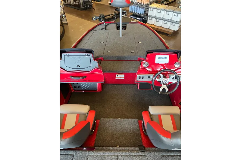 Slide: The Image of 2026 Nitro Z18 boat interior with red and gray seating, steering wheel, and dashboard. - 5